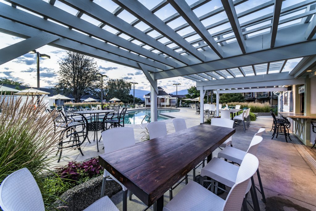 tables near the pool at Blue Tail Grill